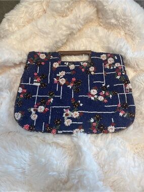 Anthropology floral grid beaded clutch in navy blue.
